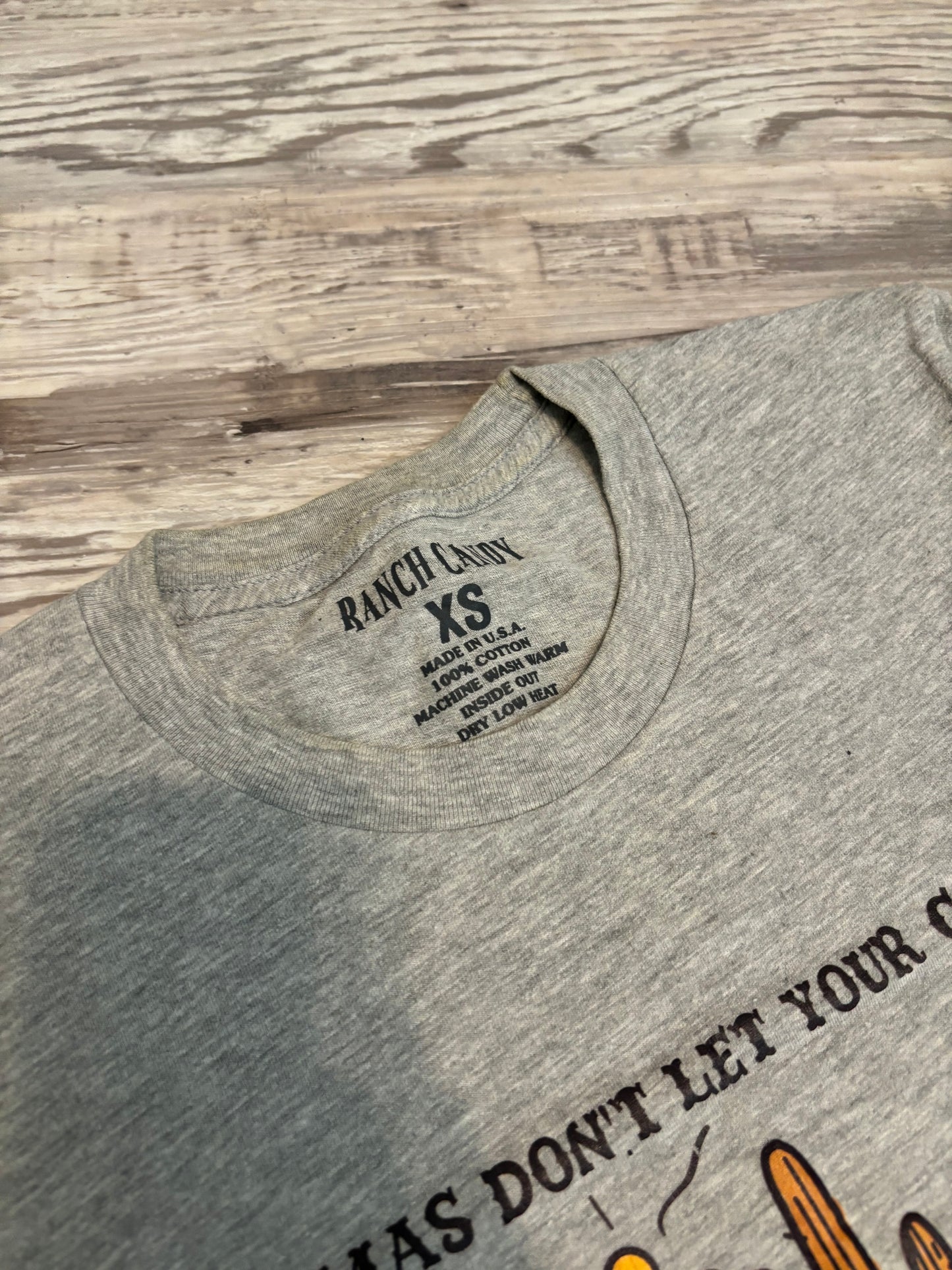 MAMAS DONT LET YOUR COWBOYS GROW UP TO BE BABIES GRAPHIC TEE