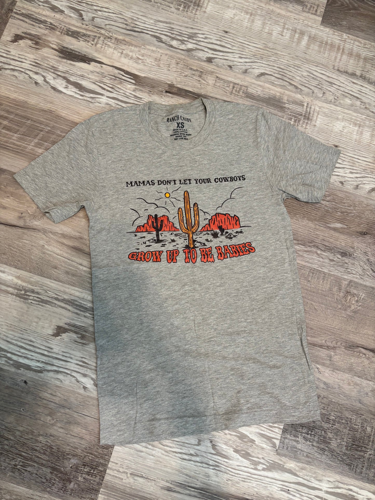 MAMAS DONT LET YOUR COWBOYS GROW UP TO BE BABIES GRAPHIC TEE